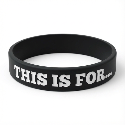 A black This Is For silicone wristband created as a physical reminder of the person, purpose or reason that matters to you.