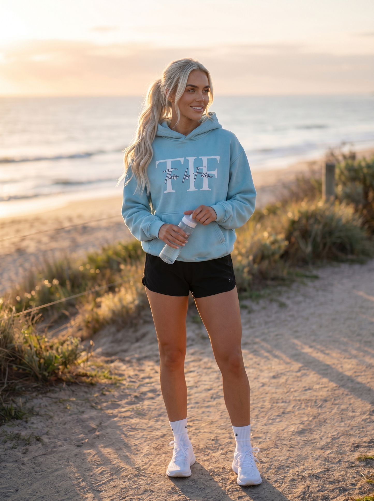 Woman wearing the This Is For... Snow Washed Oversized Fleece Hoodie in Ice Blue