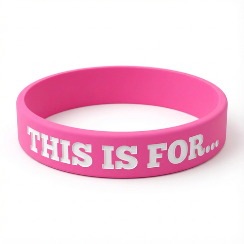 A pink This Is For silicone wristband created as a physical reminder of the person, purpose or reason that matters to you.